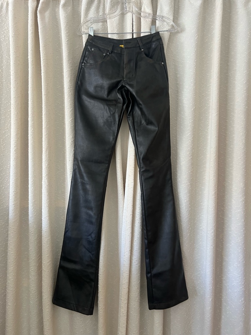 Im an XS and it fits me. Dark Brown Faux Leather Flare Pants